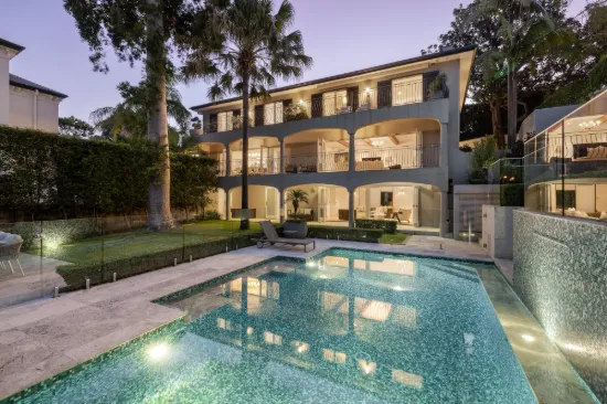 Grand peninsula home with iconic Harbour Bridge, water views & north-east aspect.