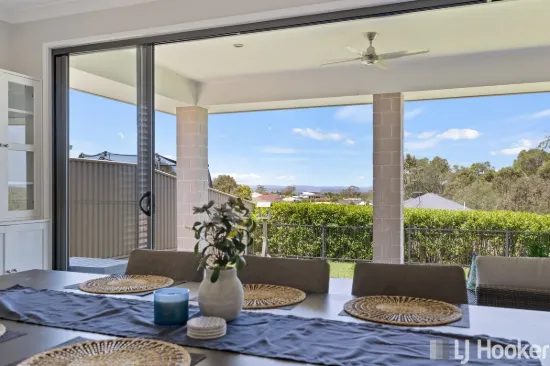 ELEVATED MODERN HOME WITH TRIPLE GARAGE & BAY VIEWS!!