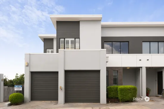 Spectacular three-bedroom townhome in boutique complex