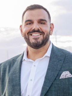 Chris Roumanous - Real Estate Agent