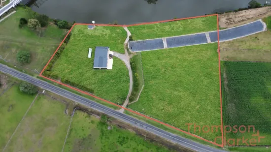 Rare Waterfront Opportunity on 5.3 Acres – Endless Potential in the Heart of Hinton