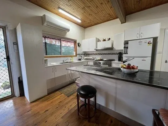 Charming 4 Bedroom Camp with Cozy Fireplace & Modern Comforts.